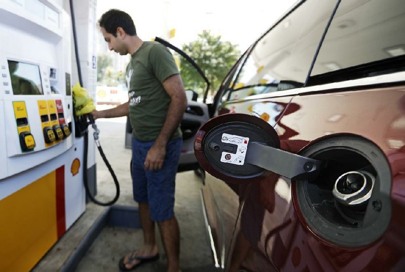 A motorist tries to pump gas at a station experiencing shortages Monday in Atlanta. A pipeline rupture has left drivers facing scarce supplies in several Southern states.