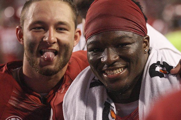Arkansas receiver Drew Morgan, left, and running back Rawleigh Williams pose for a camera during a game against Texas State on Saturday, Sept. 17, 2016, in Fayetteville. 