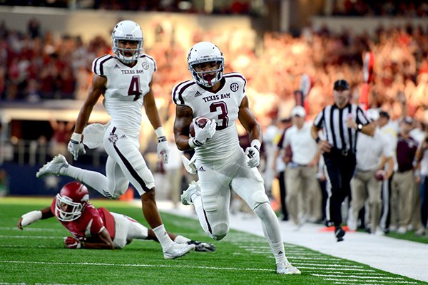 Texas A&M's Christian Kirk (3) runs down the sideline before scoring a touchdown against Arkansas during the first half of an NCAA college football game Saturday, Sept. 26, 2015, in Arlington, Texas. (Sam Craft/The Bryan-College Station Eagle via AP)