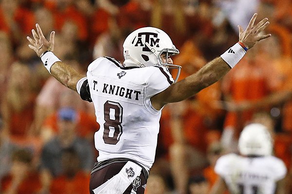 Texas A&M quarterback Trevor Knight runs across the field in celebration after running back Trayveon Williams scored a touchdown in the second half during an NCAA college football game against Auburn, Saturday, Sept. 17, 2016, in Auburn, Ala. (AP Photo/Brynn Anderson)

