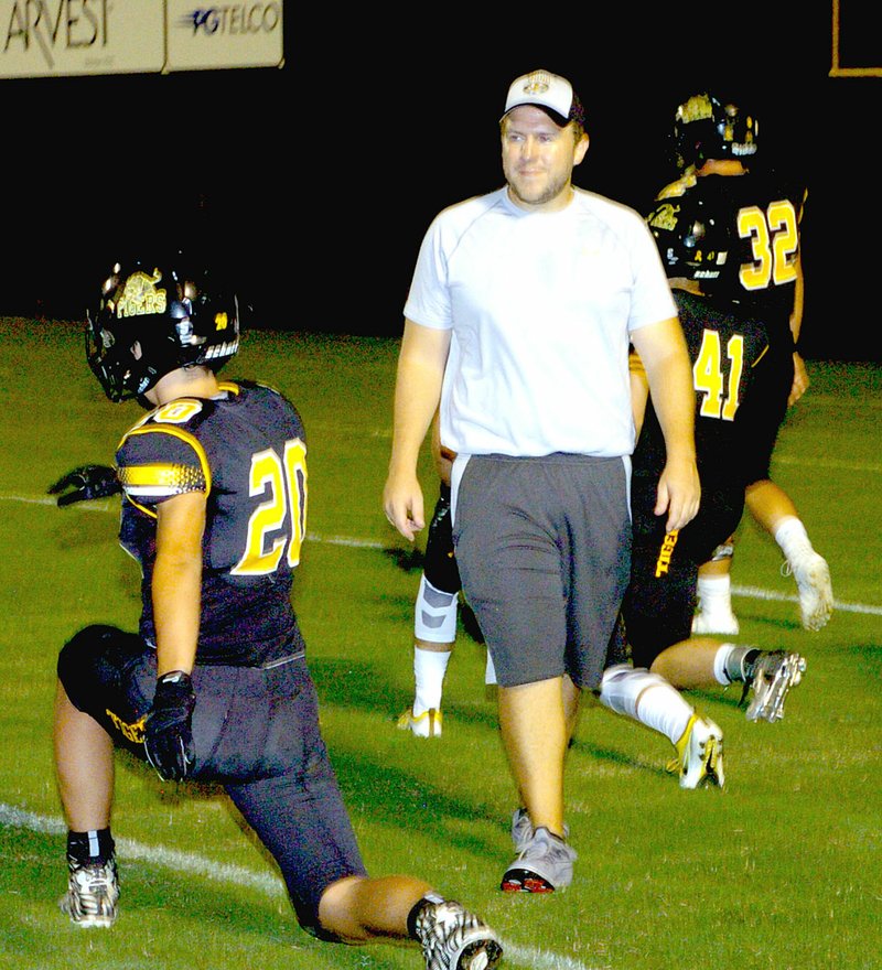 MARK HUMPHREY ENTERPRISE-LEADER Nik Paroubek is a mild-mannered Special Education teacher at Prairie Grove Middle School by day. By night, he is a valuable volunteer assistant coach for the Tiger football program.
