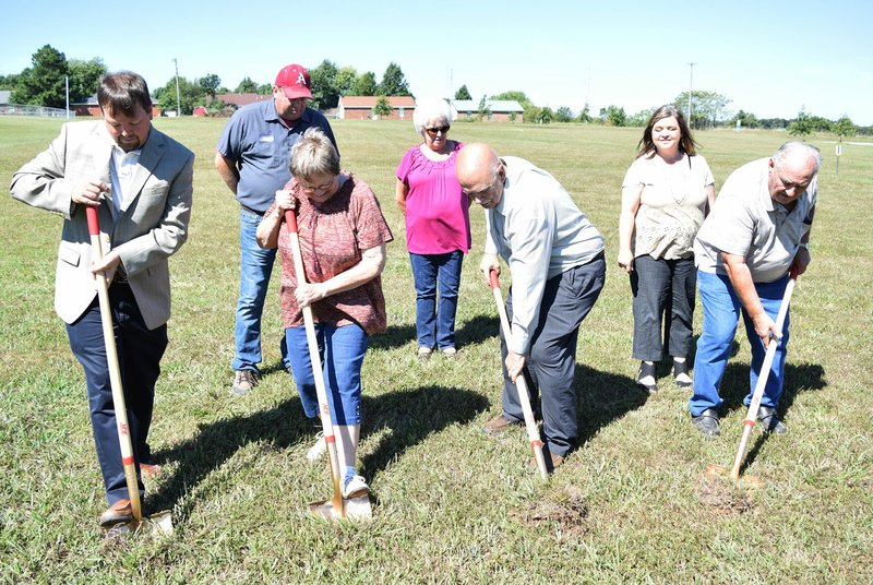 Photo by Mike Eckels Several Decatur city officials break ground on the new Decatur Soccer complex at Veterans Park in Decatur Sept. 12. They include Jeff Gravette (front, left), Linda Martin, Bob Tharp and Lester Austin. Back row includes James Boston (left), Pat Austin and Kim Wilkins.