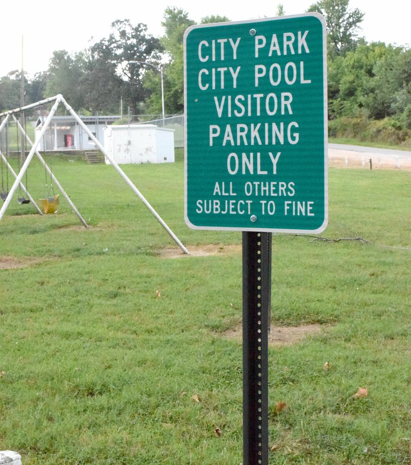 Photo by Mike Eckels Several new visitor parking signs dotted the perimeter of Decatur City Park on Sept. 14 because the city council passed a new ordinance restricting parking to park visitors only.
