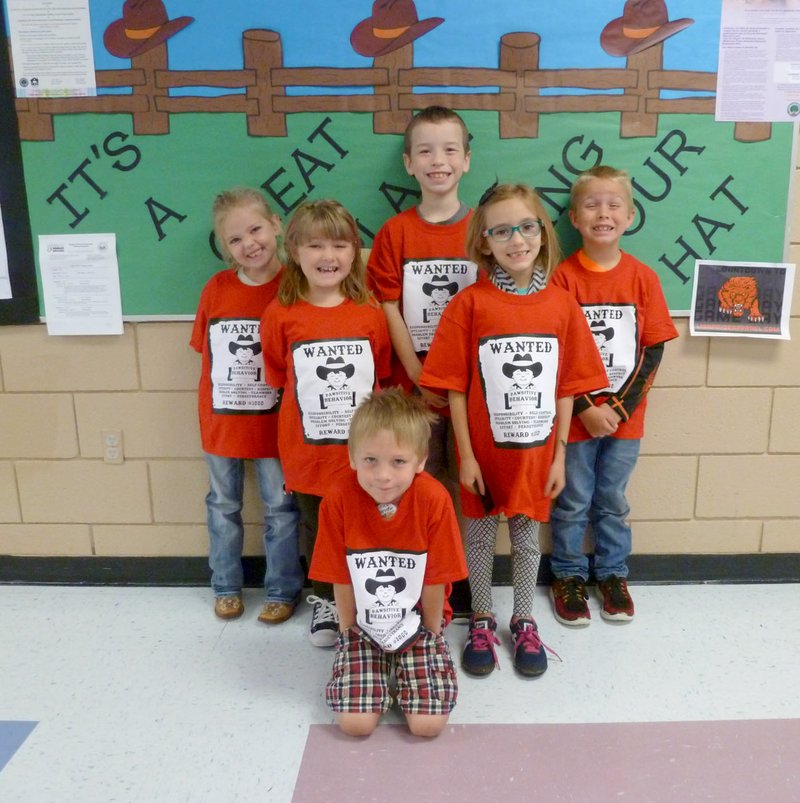 Submitted Photo These students were honored as PAWS (&quot;Pawsitive and Wise&quot;) Students of the Month for September at last week&#8217;s Rise and Shine assembly at Glenn Duffy Elementary. PAWS award winners are, standing, Natalie Holland of Sulphur Springs, Georgia Cantrell of Sulphur Springs, Noah Everett of Bella Vista, Marley Rose of Bella Vista and Blain Middleton of Sulphur Springs and, kneeling, Landon Handle of Gravette.