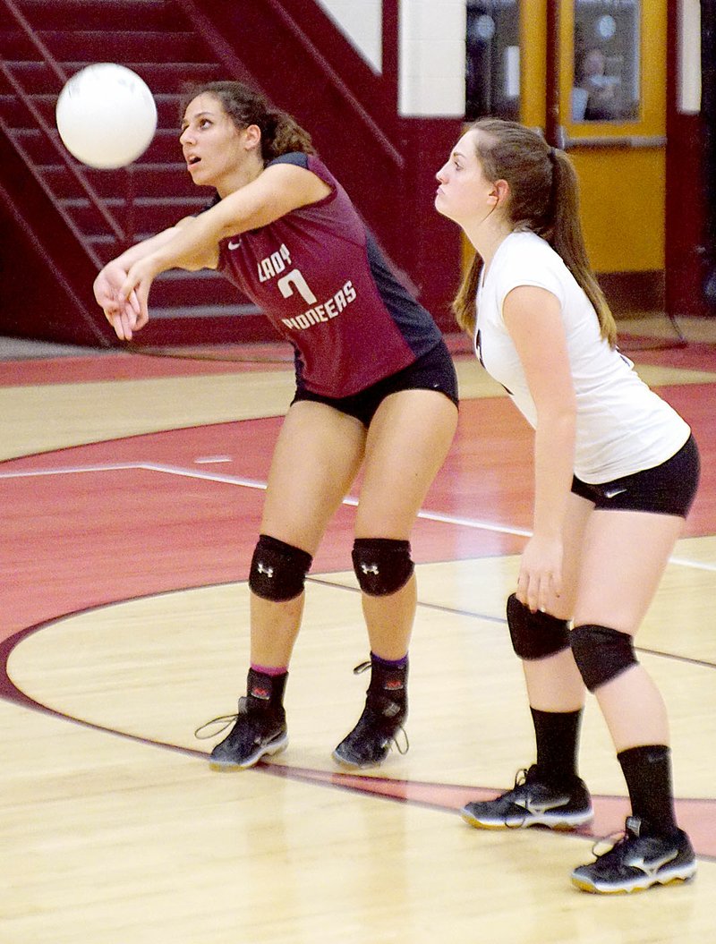 Photo by Randy Moll Hannah Boss, Gentry junior, receives a Lincoln serve on Thursday, while Bailee Pollard, Gentry sophomore, stands by.