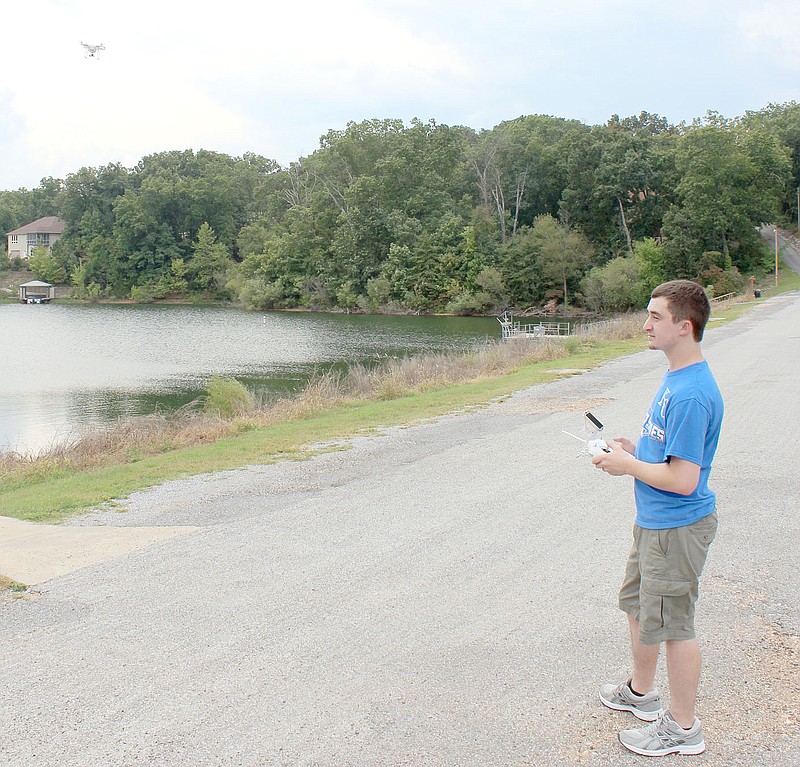 Dylan Shaddox, 23, flies his drone near Lake Brittany.