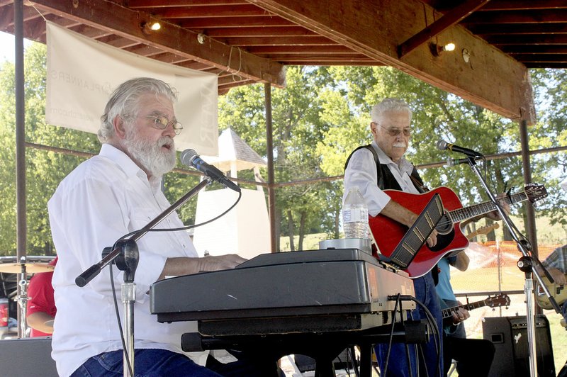 Ozark Gospel Jubilee Band performed Sunday afternoon at the 30th annual Cane Hill Harvest Festival. Members include Dee Bartholomew, left, and Ken Harvey.