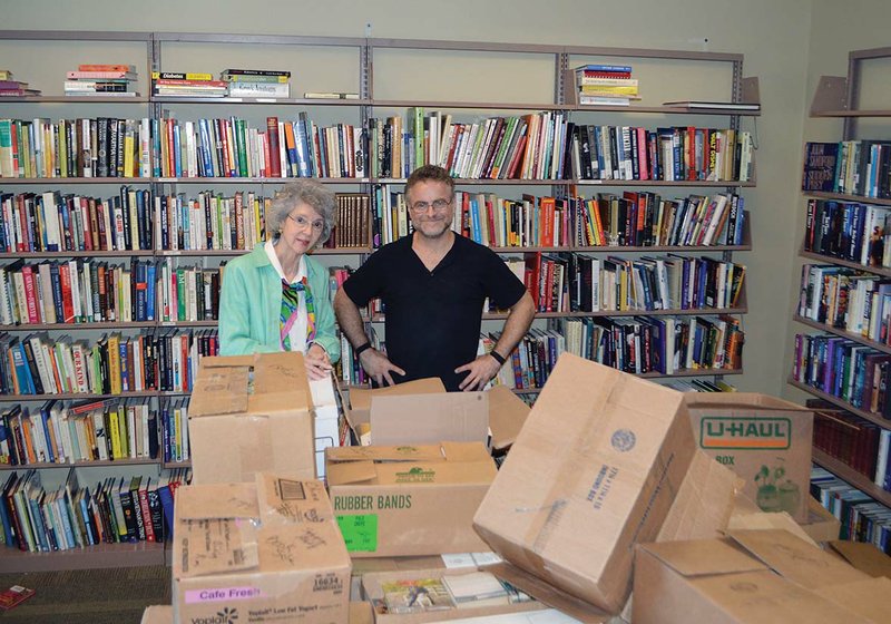 Carol Powers, president of Friends of the Libraries, and Stephen McDermott, an employee of the Faulkner County Library in Conway, stand in the Friends of the Libraries room inside the library with boxes full of books for the annual fall sale. It will take place from 6-8:30 p.m. Oct. 7 for Friends members and from 9 a.m. to 5 p.m. Oct. 8 for the public. Memberships will be sold at the door on Oct. 7, too. Powers said the proceeds will be used for projects at the Faulkner County Library and all of its branches.