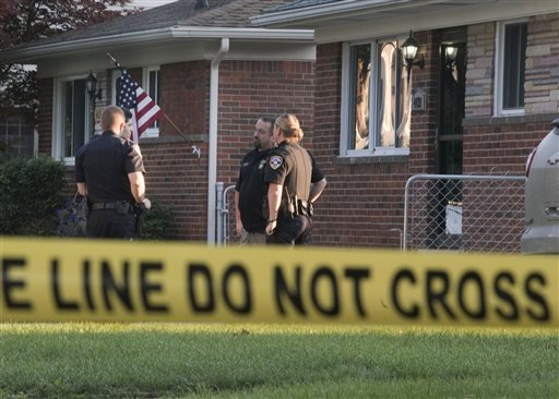 Dearborn Heights police stand outside a house at 431 Hipp St., in Dearborn Heights, Mich., on Wednesday, Sept. 21, 2016.