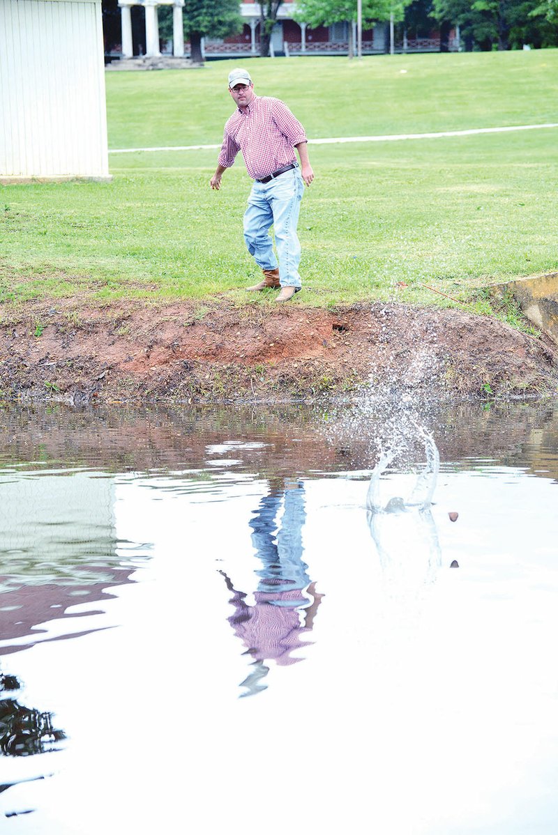John Baker, founder of the Great Southern Stone-Skipping Championships, practices skipping rocks. Baker said the event, which was held at the Fairfield Bay Marina earlier this month, raised $3,300 for food pantries in Choctaw, Clinton and Greers Ferry.