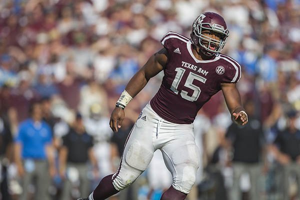 Texas A&M defensive lineman Myles Garrett (15) looks for the ball against UCLA during the third quarter of an NCAA college football game Saturday, Sept. 3, 2016, in College Station, Texas. Texas A&M won 31-24 in overtime. (AP Photo/Sam Craft)

