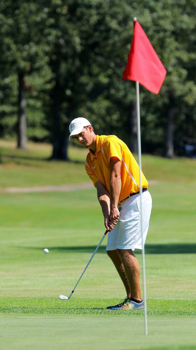 Jackson Marseilles of Harrison chips onto the green Wednesday during the 5A-West conference tournament at Greystone Country Club in Cabot. Marseilles won the boys medalist honors after shooting a 77, which was five strokes better than Andrew Freeman of Maumelle.