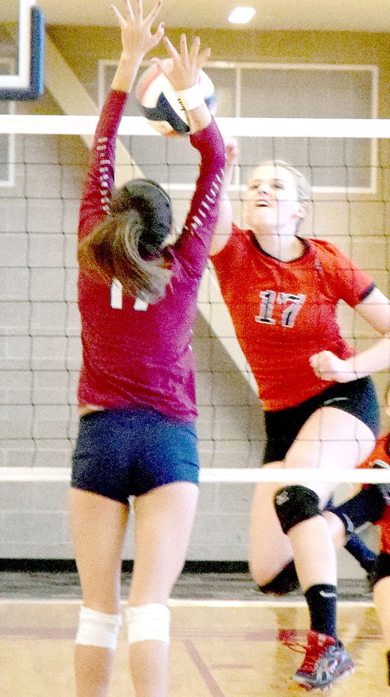 PHOTO BY RICK PECK McDonald County&#8217;s Bailey Rickett goes for a spike during the Lady Mustangs 25-23, 22-25, 14-25 loss at Joplin High School on Sept. 13.