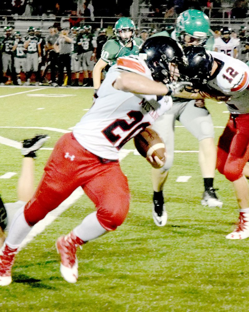 PHOTO BY RICK PECK McDonald County&#8217;s Jake Will uses a block from teammate Cole DelosSantos to help turn a short pass into a 29-yard gain in the Mustangs 53-8 loss at Mount Vernon on Friday night.