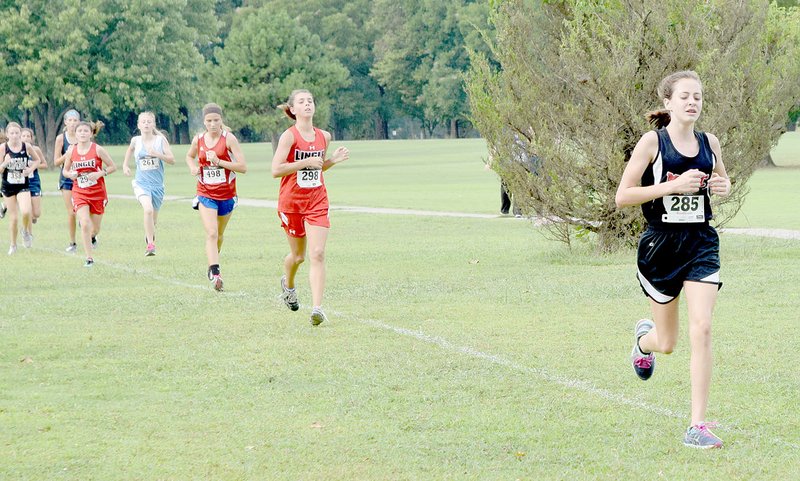 PHOTO BY RICK PECK McDonald County&#8217;s Kayln Stetina leads a group of runners on her way to a fourth place finish in the seventh grade girls race at the McDonald County Junior High Cross Country Meet held Sept. 13 at Elk River Golf Course in Noel. There were 98 runners in the field.