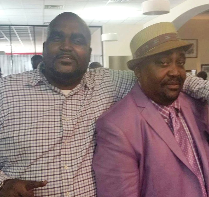 This undated photo provided by the Parks & Crump, LLC shows Terence Crutcher, left, with his father, Joey Crutcher. 