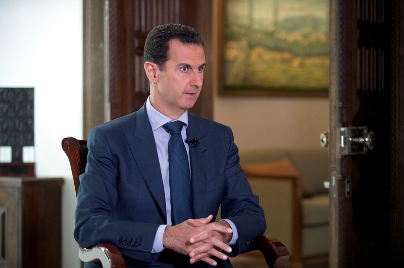 In this Wednesday, Sept. 21, 2016 photo released by the Syrian Presidency, Syrian President Bashar Assad speaks to The Associated Press at the presidential palace in Damascus, Syria. Assad said U.S. airstrikes on Syrian troops in the country’s east were “definitely intentional,” lasting for an hour, and blamed the U.S. for the collapse of a cease-fire deal brokered with Russia. In the interview with the AP, Assad said the war, now in its sixth year, is likely to “drag on” because of what he said was continued external support for his opponents. (Syrian Presidency via AP)
