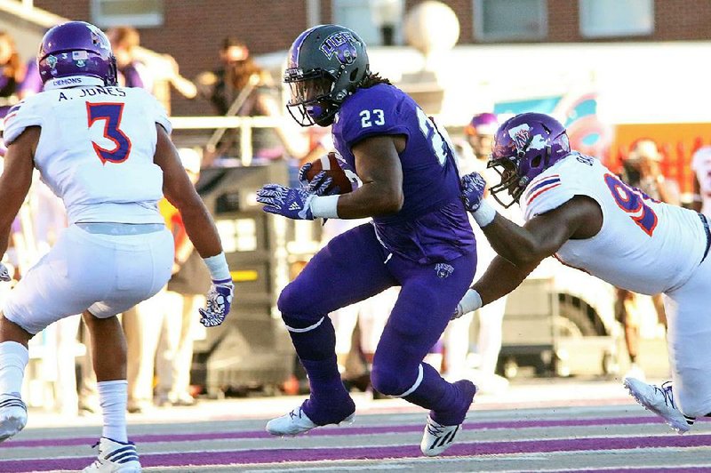 Central Arkansas running back Carlos Blackman (center) is leading the Bears’ ground attack through three games this season, but the freshman is getting help from others in the backfield.