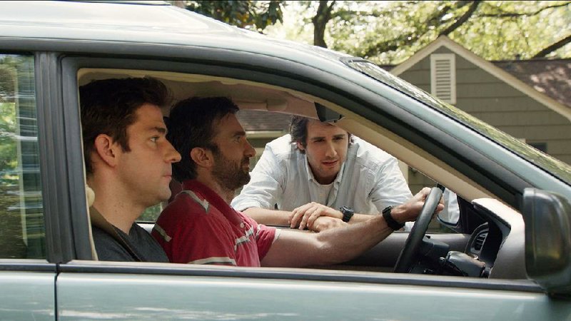 Brothers John (John Krasinski) and Ron (Sharlto Copley) are comforted by Rev. Dan (Josh Groban) in The Hollars, a quirky independent comedy directed by Krasinski.
