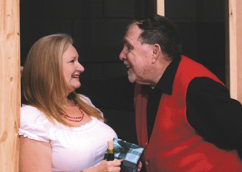 Jim Moody as Bud “the stud” tries to woo the “Romanian fruitcake,” Countess Marilena (Mary Beth McAlvain) in the Fort Smith Little Theatre production of “Money Matters.”