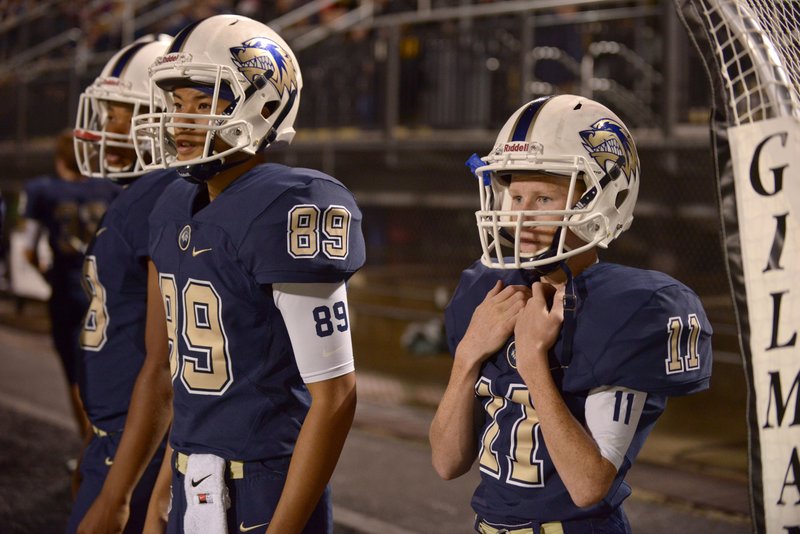 Blake McDoulett (11) and Ryan Matt (89), Bentonville West kickers, watch from the bench Sept. 16 during the game against Muskogee, Okla., at Tiger Stadium in Bentonville.