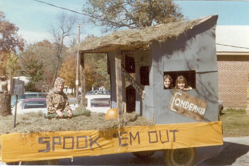 Debbie Staats (from left), Chris Dagley and Cindy Acree participate in Bentonville High School's 1974 homecoming parade in Bentonville. The school held a parade annually until it was canceled in 2006. It's returning this year.