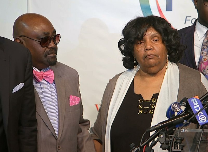 In this photo taken from video, The Rev. Joey Crutcher and Leanna Crutcher, parents of Terence Crutcher, stand at the podium at the National Action Network in New York, Wednesday, Sept. 21, 2016. Their son, Terence Crutcher, was shot and killed by a white Tulsa, Oklahoma police officer on Friday, Sept. 16, 2016. (AP Photo/Joseph Frederick)