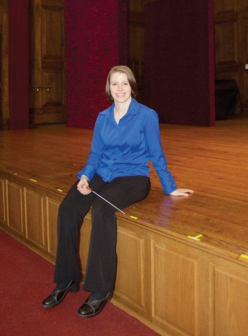 Gretchen Renshaw sits on the stage inside Reves Recital Hall at Hendrix College in Conway. The Pennsylvania native briefly considered going into medicine before majoring 