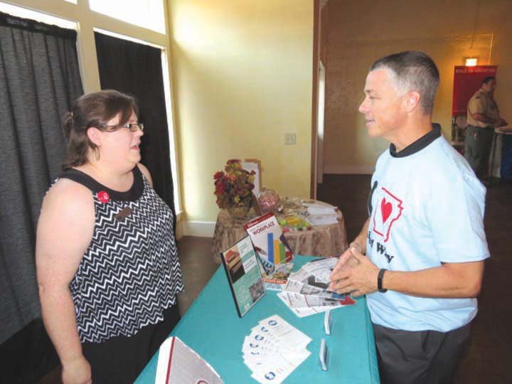 Dixie Evans, executive director of the Literacy Council of White County, talks with Glen Metheny, board president of the United Way of White County, at the United Way’s campaign-kickoff event.