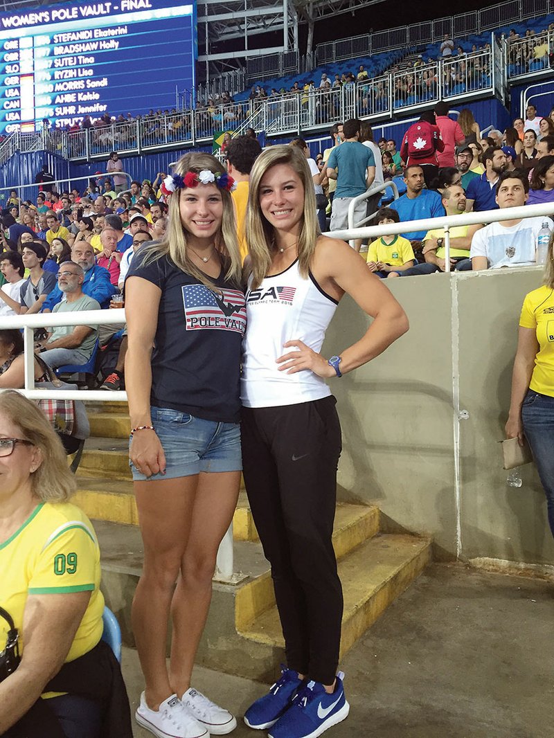 United States pole vaulter Lexi Weeks, right, poses for a photo with her twin sister, Tori, during the 2016 Summer Olympics women’s pole-vault finals Aug. 19 in Rio de Janeiro, Brazil. Lexi Weeks, of Cabot, participated in the preliminary round of the event, clearing two heights but did not advance to the finals.