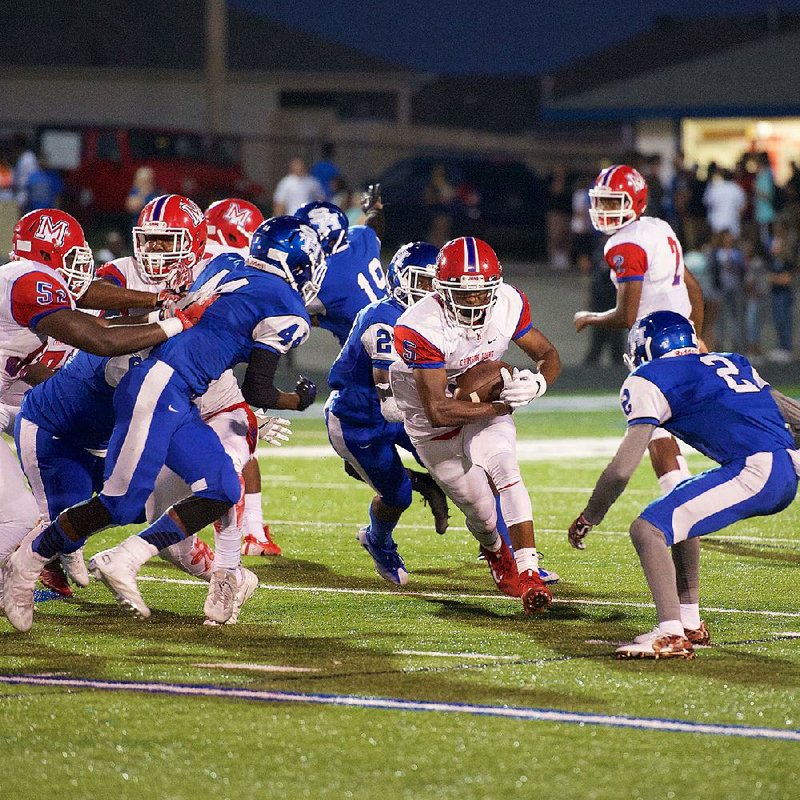 McClellan running back Pierre Strong Jr. runs up the middle against Sylvan Hills on Friday September 23, 2016