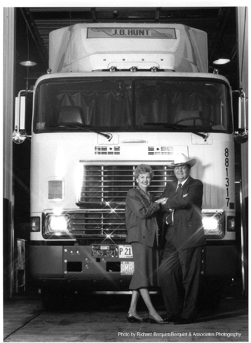 Johnelle and Johnnie Hunt stand in front of one of their trucks in 1988.