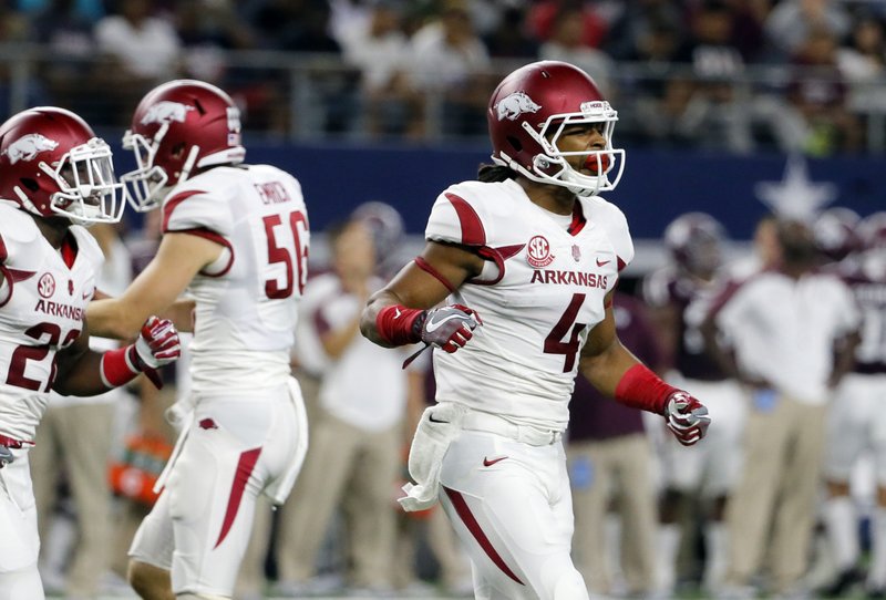 Arkansas wide receiver Keon Hatcher (4) runs off the field celebrating his touchdown catch in the first half of an NCAA college football game against Texas A&M on Saturday, Sept. 24, 2016, in Arlington, Texas. (AP Photo/Tony Gutierrez)
