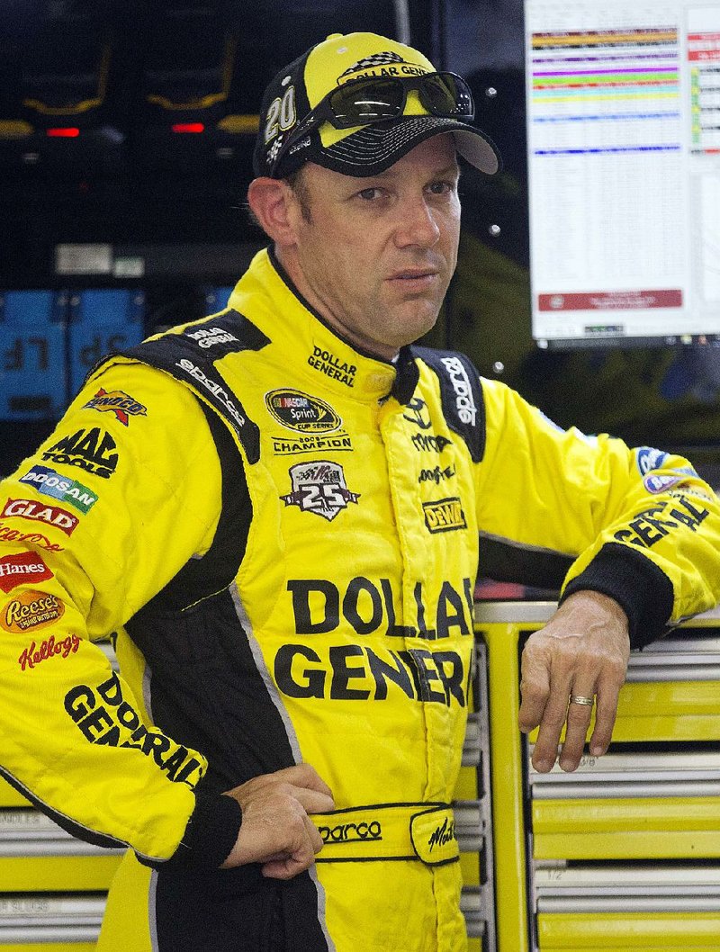 Matt Kenseth waits as his car is worked on during practice for Sunday's NASCAR Sprint Cup Series auto race at New Hampshire Motor Speedway Friday, Sept. 23, 2016, in Loudon, N.H. 