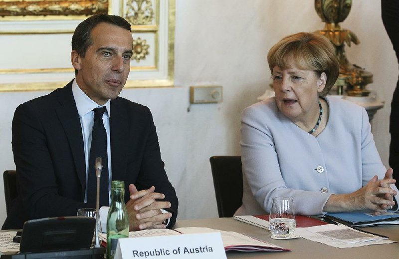 Austrian Chancellor Christian Kern talks Saturday with German Chancellor Angela Merkel in Vienna at the beginning of a meeting on strategies to deal with Europe’s migrant crisis.