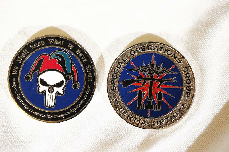 CIA Special Operations Group coins sit on display at Coin Squadron, a business in Washington Crossing, Pa., that deals in pieces of Langley, Va., lore.