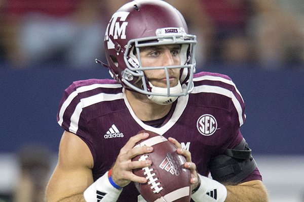 Texas A&M senior quarterback Trevor Knight rolls out against Arkansas during the second quarter on Saturday, Sept. 24, 2016, at AT&T Stadium in Arlington, Texas.