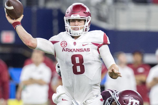Arkansas quarterback Austin Allen throws while being hit in Saturday's 45-24 loss to Texas A&M.