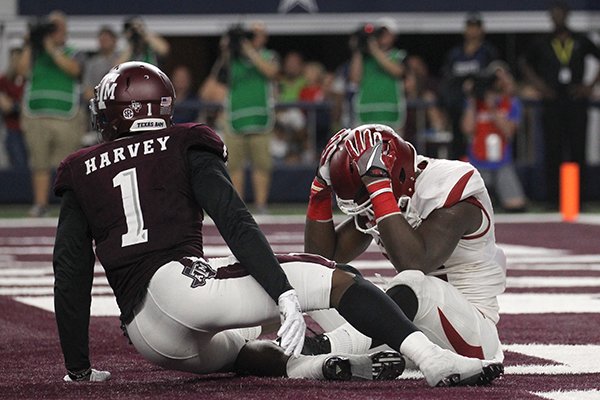 Arkansas running back Rawleigh Williams reacts after losing a fumble during a game against Texas A&M on Saturday, Sept. 24, 2016, in Arlington, Texas. 