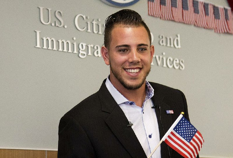 In this Friday, April 24, 2015, file photo, Miami Marlins pitcher Jose Fernandez smiles after becoming a U.S. citizen during a naturalization ceremony in Miami. 