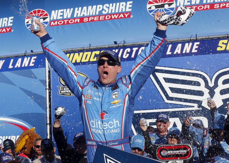 Kevin Harvick celebrates in Victory Lane after winning the NASCAR Sprint Cup Series auto race at New Hampshire Motor Speedway, Sunday, Sept. 25, 2016, in Loudon, N.H. 