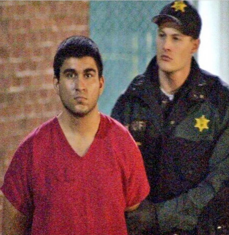 This late Saturday, Sept. 24, 2016, image from video by KIRO7 photographer Jeff Ritter shows suspected Cascade Mall shooter Arcan Cetin at Skagit County Jail in Mount Vernon, Wash., after his arrest in Oak Harbor, Wash., earlier in the evening. Investigators on Sunday tried to piece together information on the 20-year-old suspect in the deadly Washington state mall shootings who was apprehended after a nearly 24-hour manhunt. (Jeff Ritter/KIRO7.com via AP)