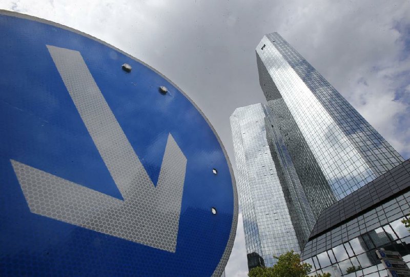 Deutsche Bank’s headquarters in Frankfurt, Germany, is shown in this file photo. The bank’s shares fell Monday after a magazine report said the government is not inclined to help the bank handle a settlement with U.S. officials.