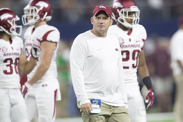 Arkansas defensive coordinator Robb Smith watches warmups prior to a game against Texas A&M on Saturday, Sept. 24, 2016, in Arlington, Texas. 