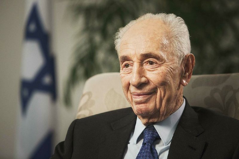 In this Nov. 2, 2015 file photo, former Israeli President Shimon Peres speaks during an interview with The Associated Press in Jerusalem. 