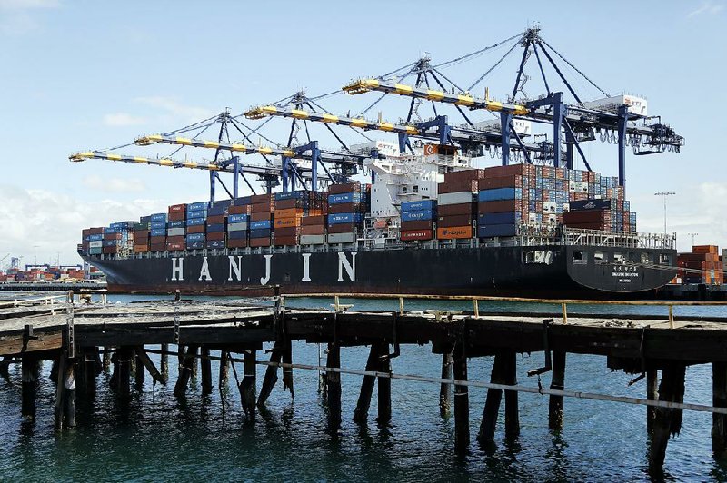 The container ship Hanjin Boston is unloaded at the Port of Los Angeles earlier this month. The A.P. Moeller-Maersk A/S’ container line will try to purchase the struggling Hanjin line, analysts said Tuesday.