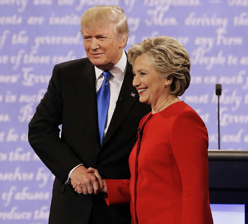 Republican Donald Trump shakes hands with Democrat Hillary Clinton on Monday during the presidential debate at Hofstra University in Hempstead, N.Y.