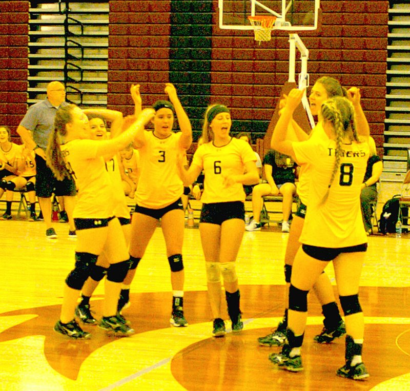 MARK HUMPHREY ENTERPRISE-LEADER The Prairie Grove volleyball team, shown celebrating an ace against Lincoln, defeated Decatur in three straight sets, 25-9, 25-24 and 25-17, Sept. 15.