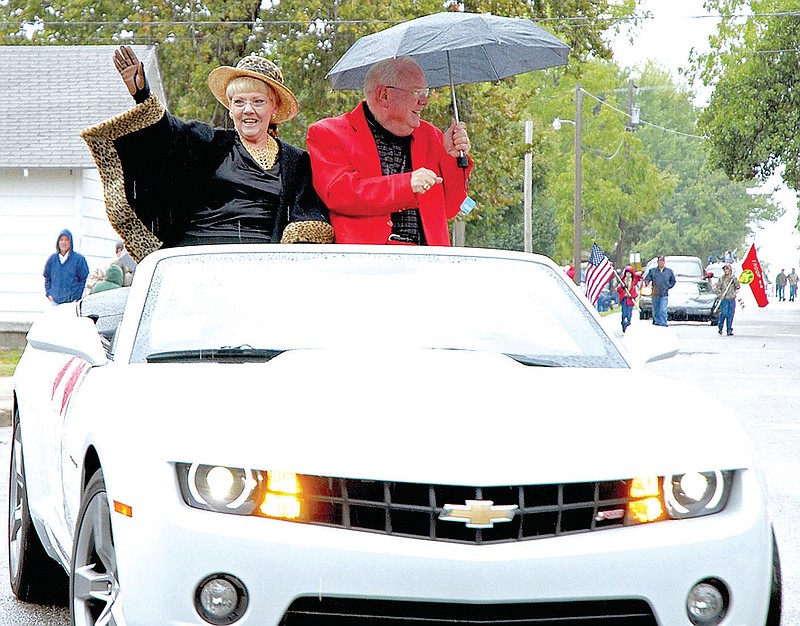 FILE PHOTO Russ and Rainy Laycox served as parade marshals for the 2012 Arkansas Apple Festival. Both have volunteered and worked at many of the festivals over the years.