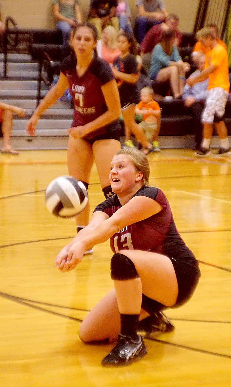 Photo by Randy Moll Natallie Robinson drops to her knees for a dig during play against Gravette at Gravette High School on Sept. 20, 2016.